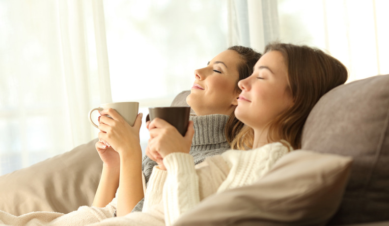 Two Hilo customers wrapped up warm with a coffee or hot chocolate