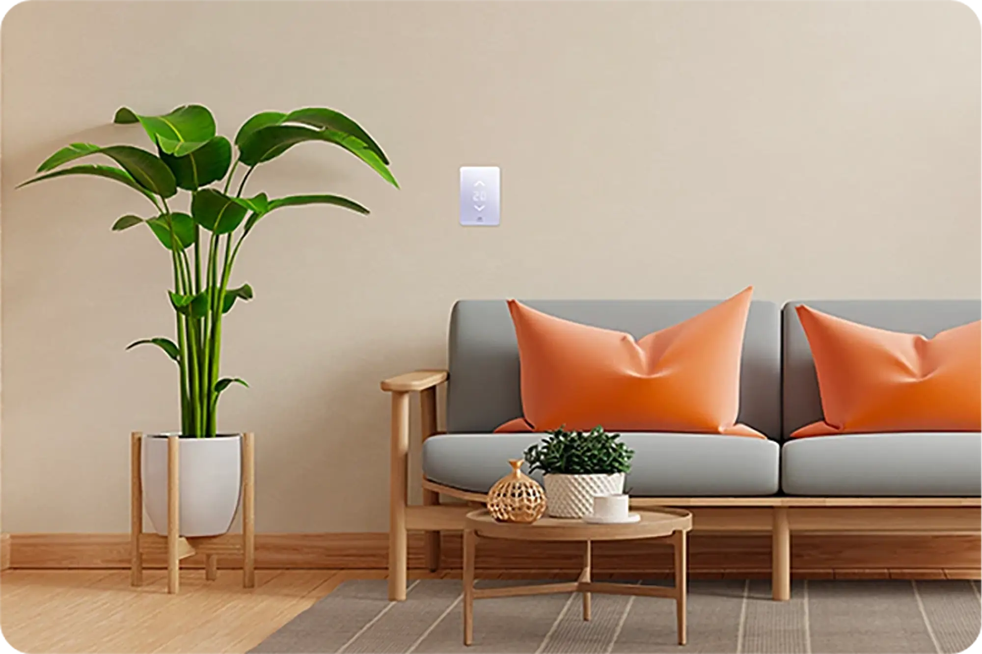 A gray sofa with orange cushions and a small wooden table with a plant and accessories, in front of a beige wall where a Mysa thermostat is mounted, displaying 20°C.